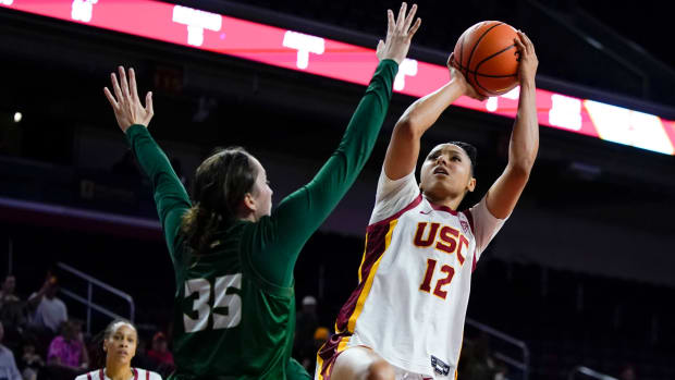 USC guard JuJu Watkins shoots against Cal Poly forward Natalia Ackerman.